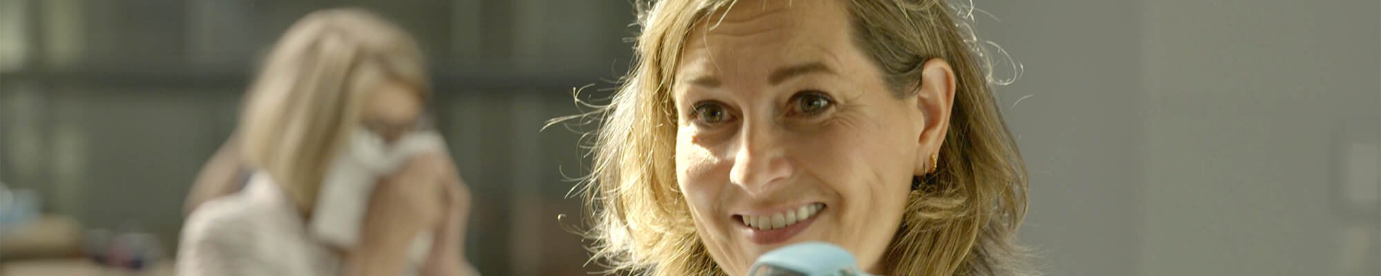 Smiling Ulrike Nagel with blonde hair in the Beeld & Geluid museum in Hilversum